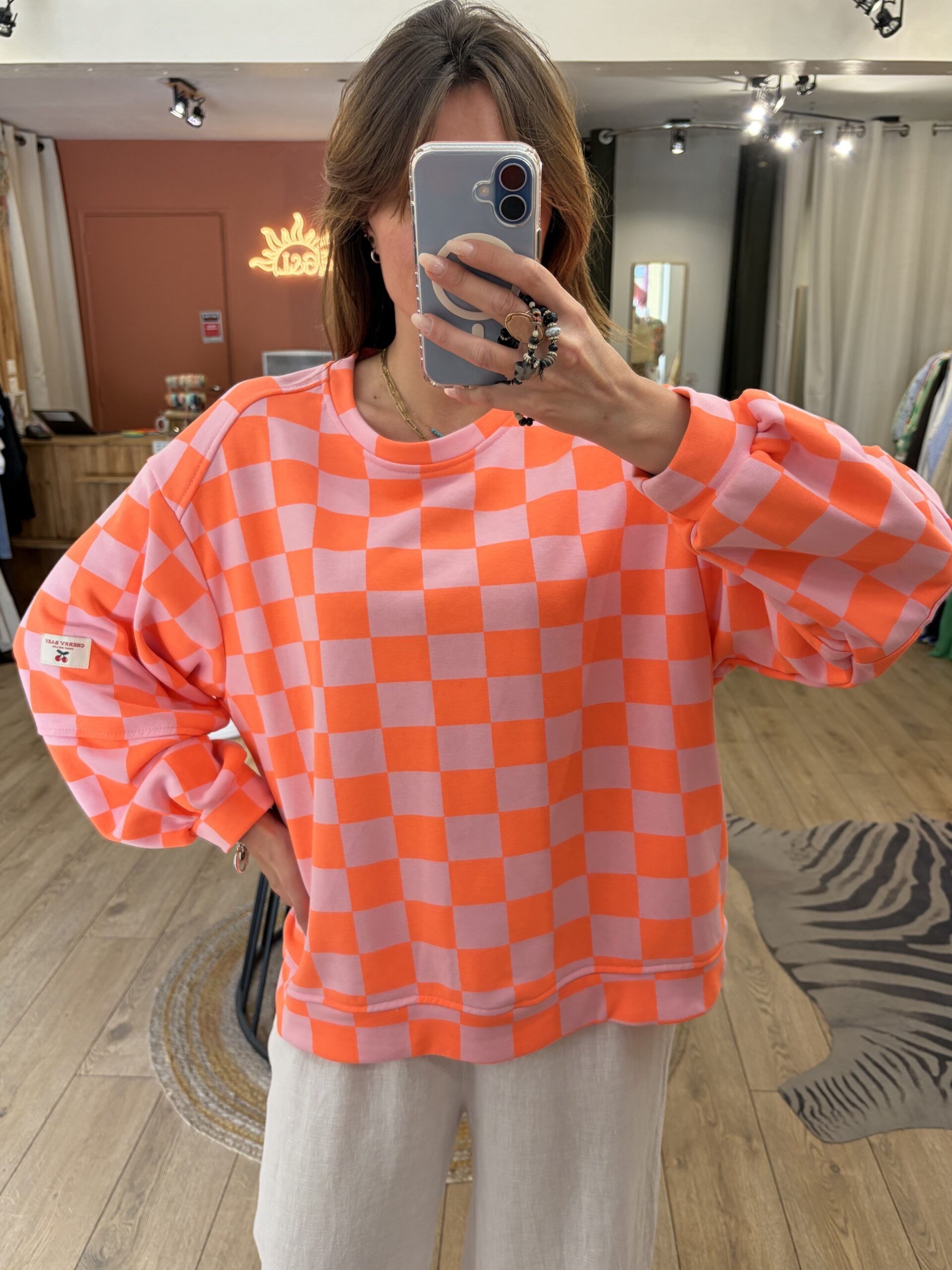 Pull damier orange et parme